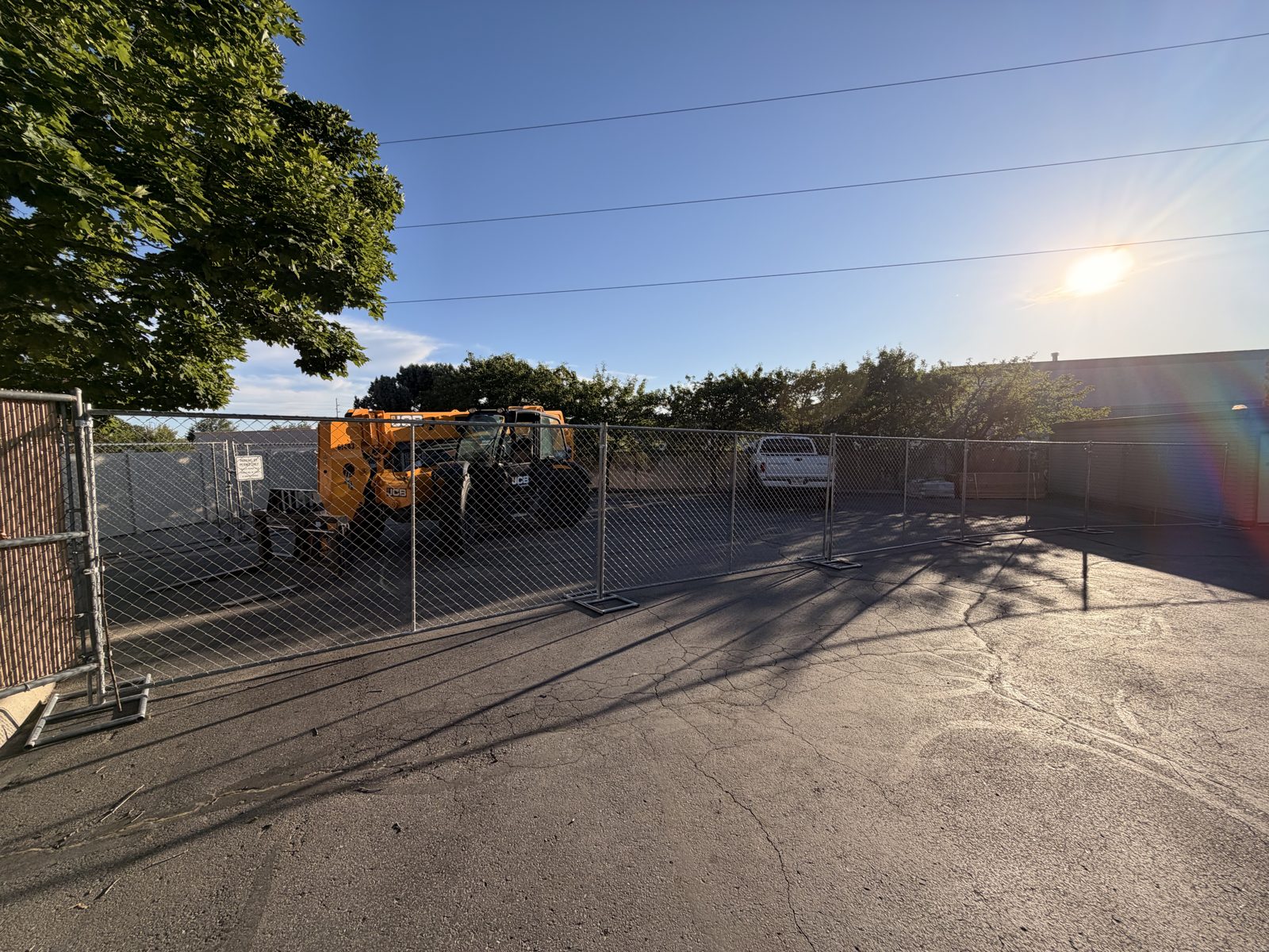 Temporary fence securing an equipment yard